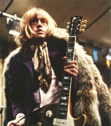 brian-with-guitar-and-coat