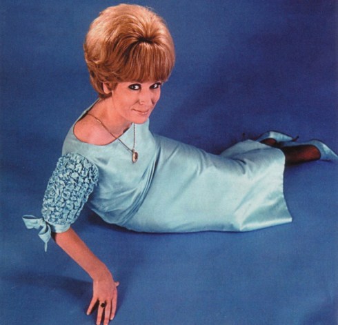 Dusty Springfield rocked a Blonde Wig and a Column Dress