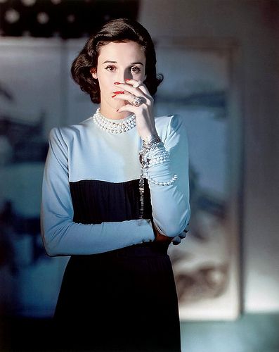 (Babe Paley) wearing a Creation of Traina-Norell, photographed by Horst P. Horst from American Vogue in 1946.