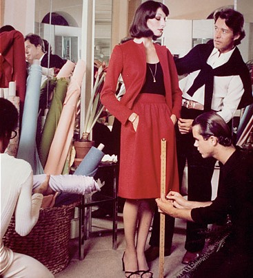 Sprouse, lower right, assists Halston with a fitting on actress Anjelica Houston in the early seventies