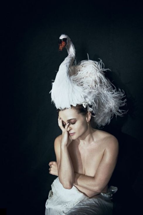 Helena Bonham Carter wears a fabulous swan headpiece by Stephen Jones for Giles Deacon