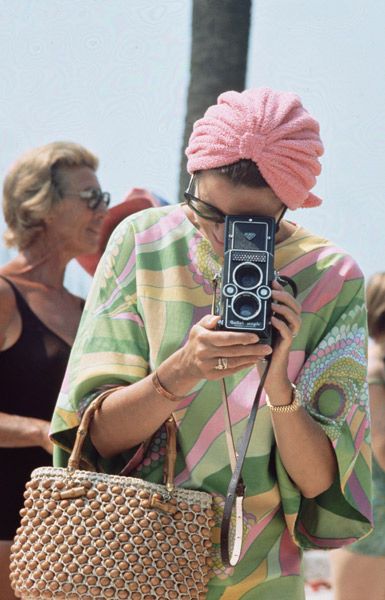 Grace Kelly was the most beautiful and chic woman. Here she's taking photos at a 1972