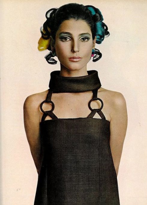 Benedetta Barzini in a brown, cowled linen dress by Christian Dior, photo by Avedon for Vogue 1967